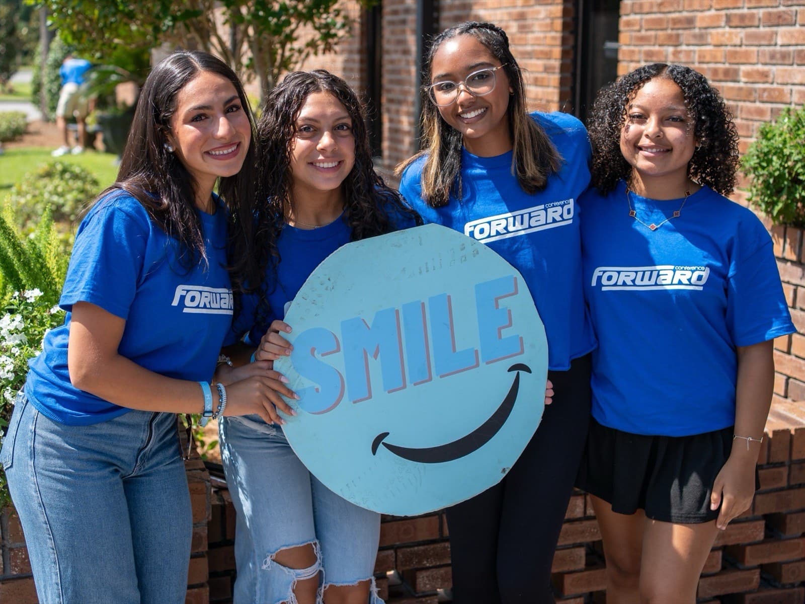 Young adults with a smile sign
